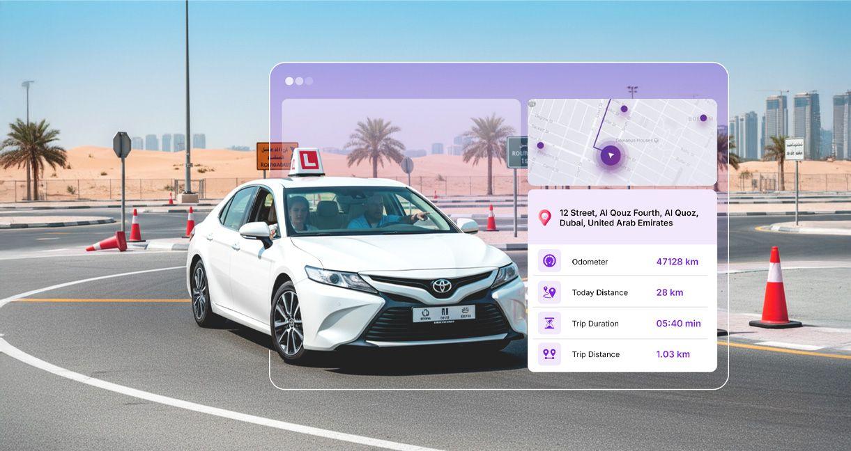Driving school vehicle in Dubai with real-time fleet monitoring dashboard showing location, trip distance, duration, and vehicle data using telematics software.